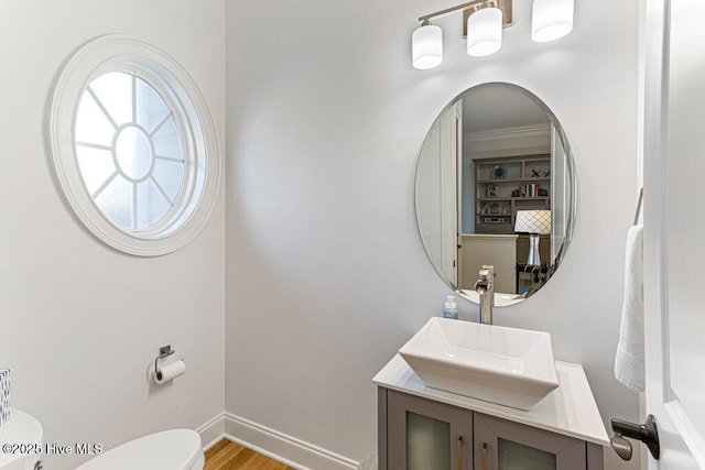 177 National Dr, Pinehurst, NC 28374 - bathroom with toilet, vanity, wood finished floors, and baseboards