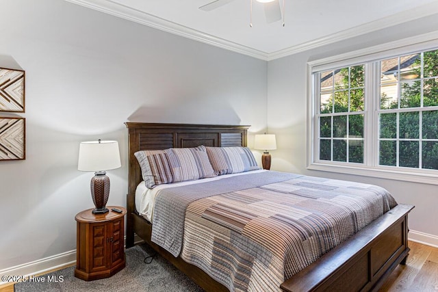 177 National Dr, Pinehurst, NC 28374 - bedroom with baseboards, ornamental molding, ceiling fan, and wood finished floors