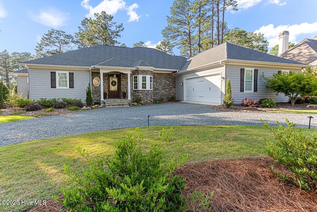 177 National Dr, Pinehurst, NC 28374 - ranch-style home featuring gravel driveway, an attached garage, a front lawn, and a chimney