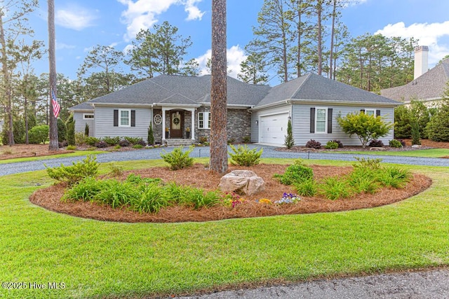 177 National Dr, Pinehurst, NC 28374 - ranch-style house with curved driveway, a front lawn, and a garage