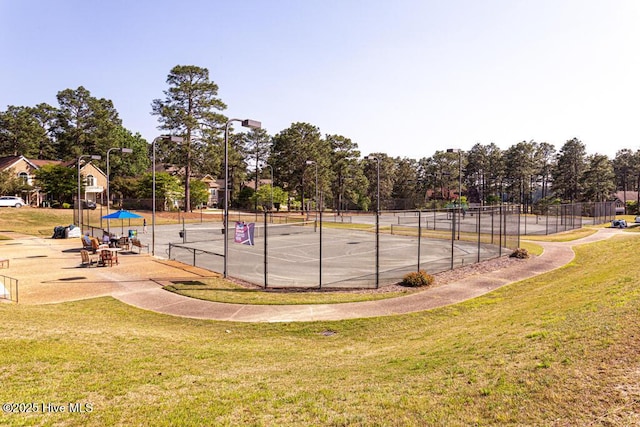 177 National Dr, Pinehurst, NC 28374 - view of tennis court with view of wooded area