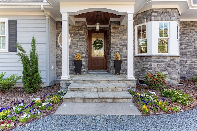 177 National Dr, Pinehurst, NC 28374 - doorway to property with stone siding and covered porch