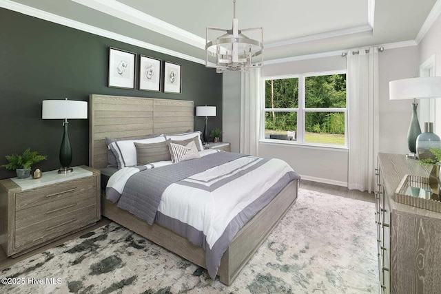 285 Hawks Run Dr Unit 4068, Carolina Shores, NC 28467 - bedroom featuring crown molding, a chandelier, baseboards, wood finished floors, and a raised ceiling