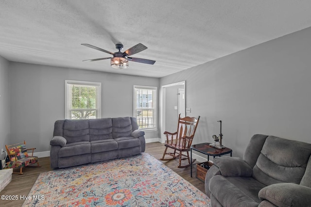 815 Gadwell Loop, Jacksonville, NC 28540 - living area with ceiling fan, a textured ceiling, baseboards, and wood finished floors