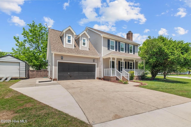 815 Gadwell Loop, Jacksonville, NC 28540 - view of front of house featuring a porch, an attached garage, a chimney, driveway, and a shingled roof