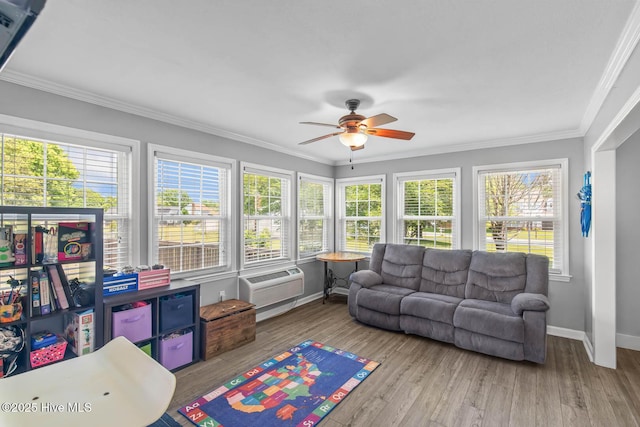 815 Gadwell Loop, Jacksonville, NC 28540 - sunroom with healthy amount of natural light, baseboards, crown molding, wood finished floors, and a deck