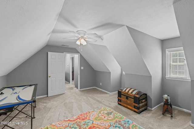 815 Gadwell Loop, Jacksonville, NC 28540 - bedroom featuring carpet, vaulted ceiling, a ceiling fan, a textured ceiling, and baseboards