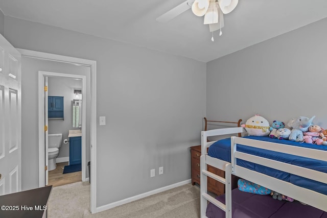 815 Gadwell Loop, Jacksonville, NC 28540 - carpeted bedroom with baseboards, a ceiling fan, and ensuite bathroom