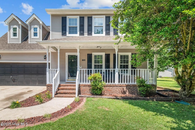815 Gadwell Loop, Jacksonville, NC 28540 - view of front of property with covered porch, concrete driveway, a front yard, an attached garage, and a shingled roof