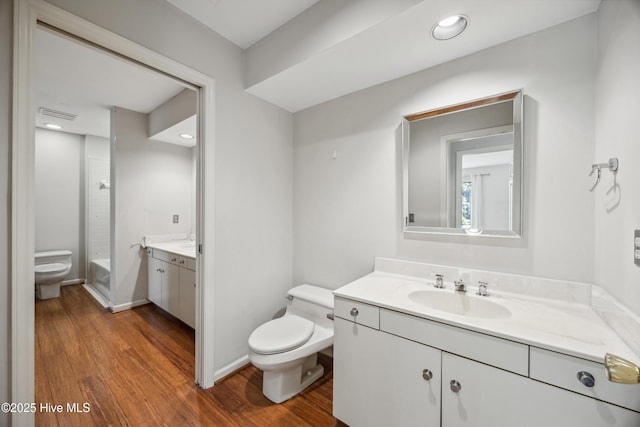 7 Prichard Ln, Pinehurst, NC 28374 - full bath with toilet, wood finished floors, vanity, and bathtub / shower combination