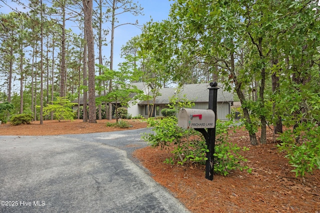 7 Prichard Ln, Pinehurst, NC 28374 - view of front facade featuring asphalt driveway and roof with shingles