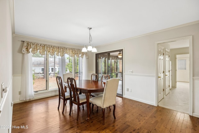7 Prichard Ln, Pinehurst, NC 28374 - dining room featuring a chandelier, wood-type flooring, ornamental molding, and baseboards