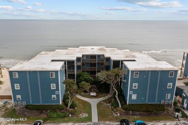 view of subject property with a nearby body of water