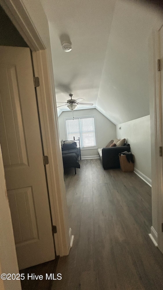 87 Strut Way, Rocky Point, NC 28457 - bedroom with lofted ceiling, wood-type flooring, and baseboards