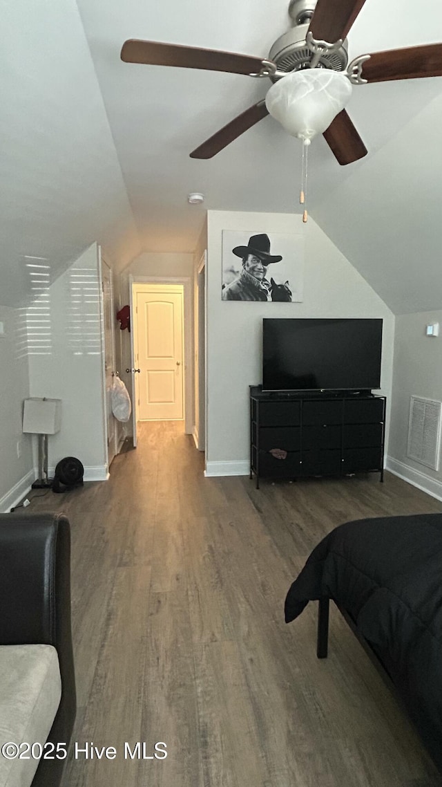 87 Strut Way, Rocky Point, NC 28457 - bedroom with vaulted ceiling, wood finished floors, baseboards, and ceiling fan