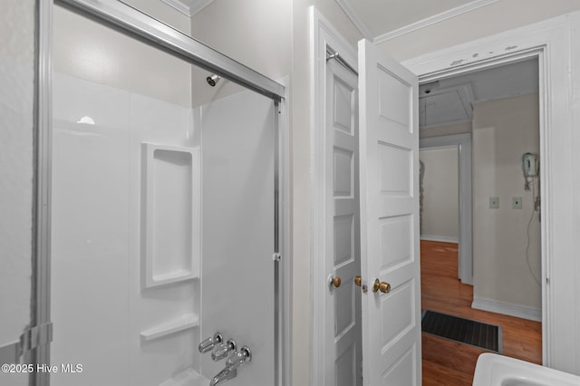 1704 Charlotte Ave, Kinston, NC 28501 - bathroom with wood finished floors, ornamental molding, and bathtub / shower combination
