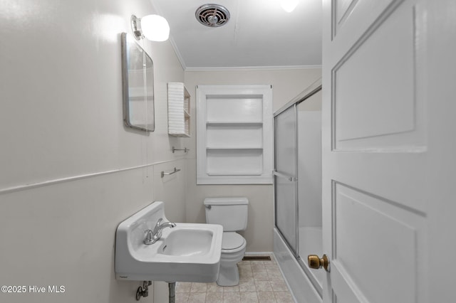 1704 Charlotte Ave, Kinston, NC 28501 - bathroom with toilet, crown molding, a sink, and bath / shower combo with glass door