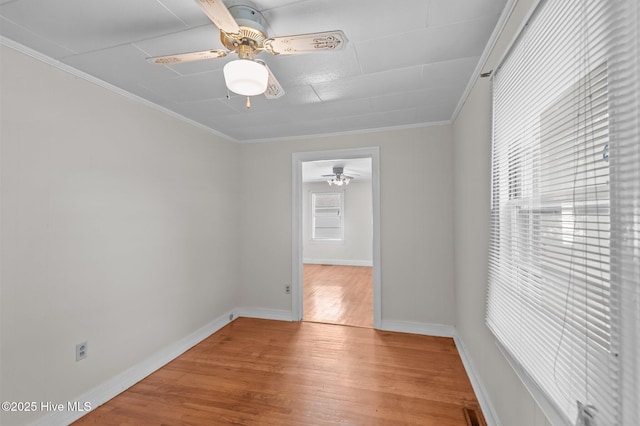 1704 Charlotte Ave, Kinston, NC 28501 - empty room featuring ceiling fan, wood finished floors, crown molding, and baseboards