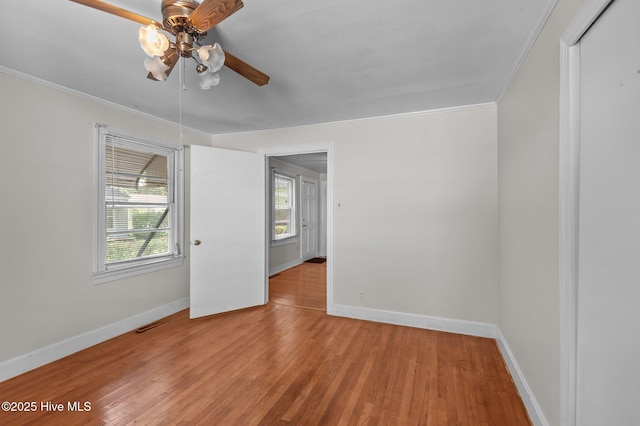 1704 Charlotte Ave, Kinston, NC 28501 - empty room featuring ceiling fan, ornamental molding, wood finished floors, and baseboards