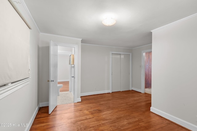 1704 Charlotte Ave, Kinston, NC 28501 - unfurnished room featuring wood finished floors, baseboards, and crown molding