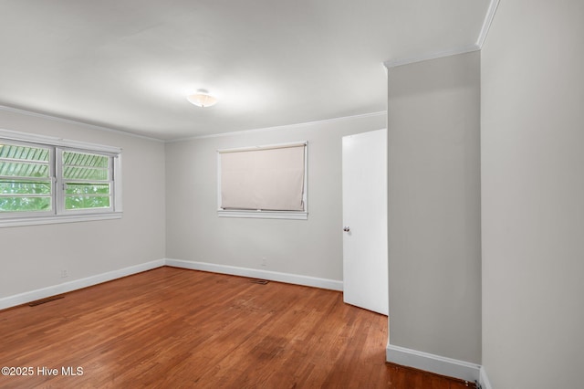 1704 Charlotte Ave, Kinston, NC 28501 - unfurnished room with ornamental molding, wood finished floors, and baseboards