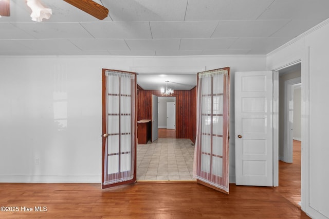 1704 Charlotte Ave, Kinston, NC 28501 - empty room featuring wood finished floors, a chandelier, and baseboards