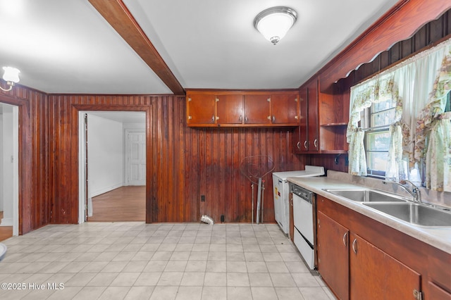 1704 Charlotte Ave, Kinston, NC 28501 - kitchen with dishwasher, a sink, light countertops, wood walls, and open shelves