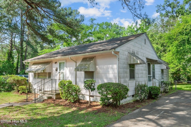 1704 Charlotte Ave, Kinston, NC 28501 - view of side of property featuring crawl space and a shingled roof