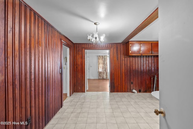 1704 Charlotte Ave, Kinston, NC 28501 - unfurnished dining area featuring a chandelier and wood walls