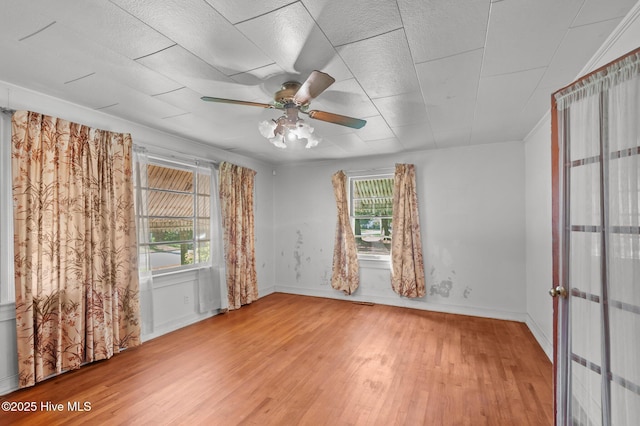 1704 Charlotte Ave, Kinston, NC 28501 - empty room with wood finished floors, ceiling fan, and baseboards