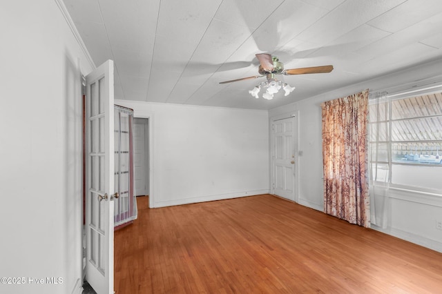 1704 Charlotte Ave, Kinston, NC 28501 - empty room featuring wood finished floors, a ceiling fan, and baseboards