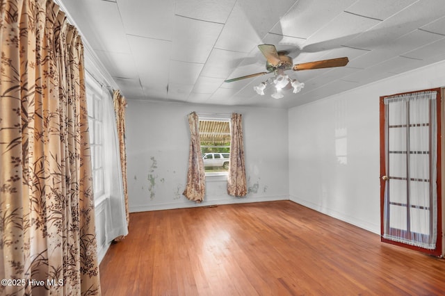 1704 Charlotte Ave, Kinston, NC 28501 - spare room with wood finished floors, baseboards, and ceiling fan