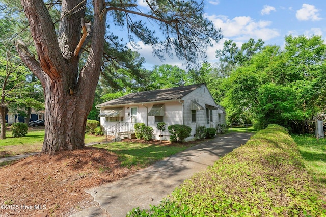 1704 Charlotte Ave, Kinston, NC 28501 - view of front of house featuring roof with shingles and driveway