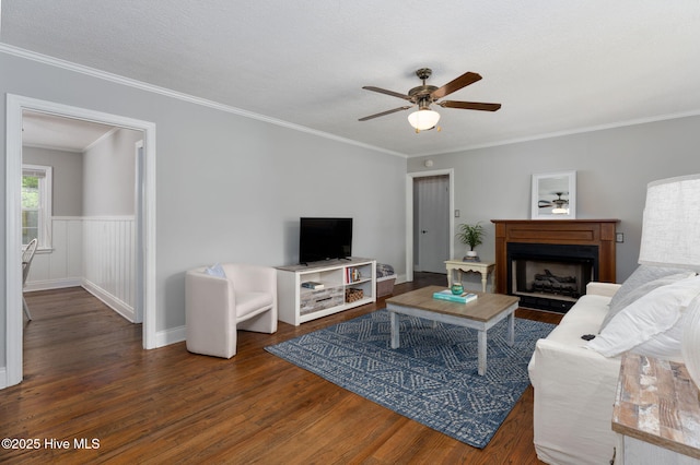 211 Spruce Cir, Wilmington, NC 28403 - living room with wood finished floors, ceiling fan, crown molding, and a fireplace