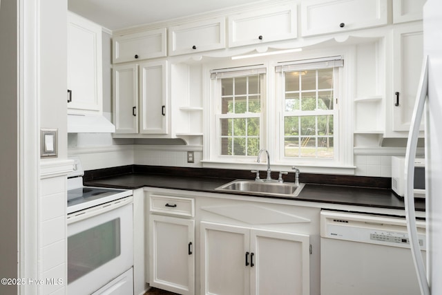 211 Spruce Cir, Wilmington, NC 28403 - kitchen featuring white appliances, open shelves, a sink, dark countertops, and tasteful backsplash