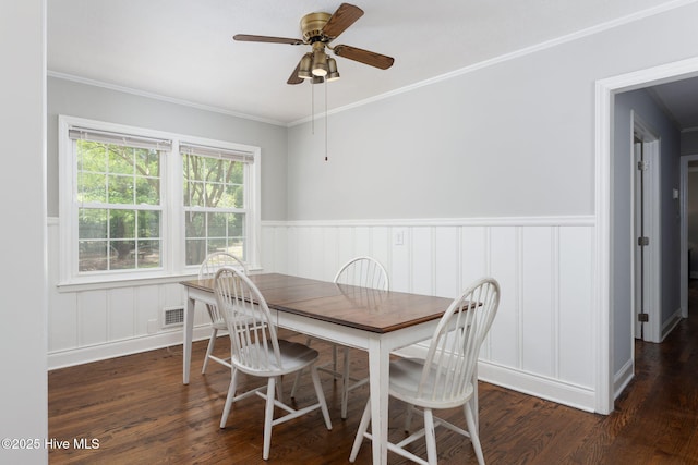 211 Spruce Cir, Wilmington, NC 28403 - dining room with wood finished floors, wainscoting, a ceiling fan, ornamental molding, and a decorative wall
