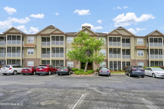 395 S Crow Creek Dr Unit 2306, Calabash, NC 28467 - view of apartment building / complex with uncovered parking