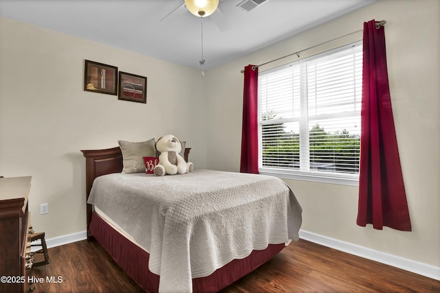 395 S Crow Creek Dr Unit 2306, Calabash, NC 28467 - bedroom with baseboards, wood finished floors, and ceiling fan