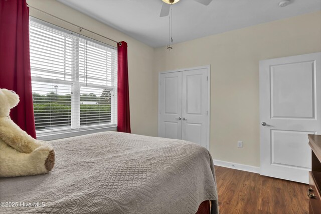 395 S Crow Creek Dr Unit 2306, Calabash, NC 28467 - bedroom featuring dark wood-style floors, a closet, baseboards, and a ceiling fan
