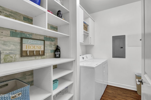 395 S Crow Creek Dr Unit 2306, Calabash, NC 28467 - washroom featuring electric panel, washer and dryer, baseboards, dark wood-style flooring, and cabinet space