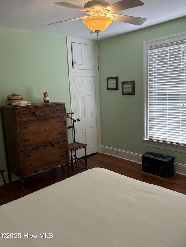 215 W Queen St, Edenton, NC 27932 - bedroom with dark wood-type flooring, baseboards, and ceiling fan