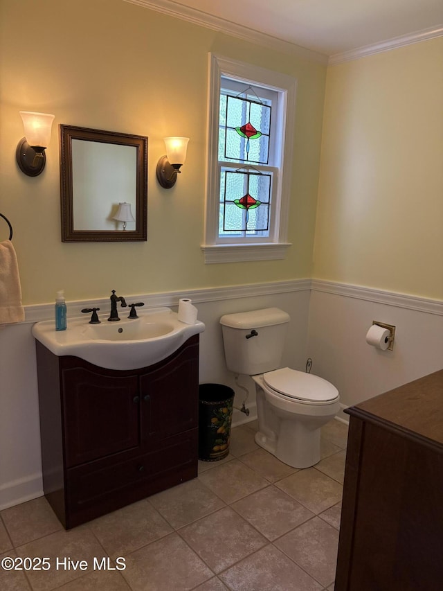 215 W Queen St, Edenton, NC 27932 - half bathroom with vanity, a wainscoted wall, toilet, crown molding, and tile patterned flooring