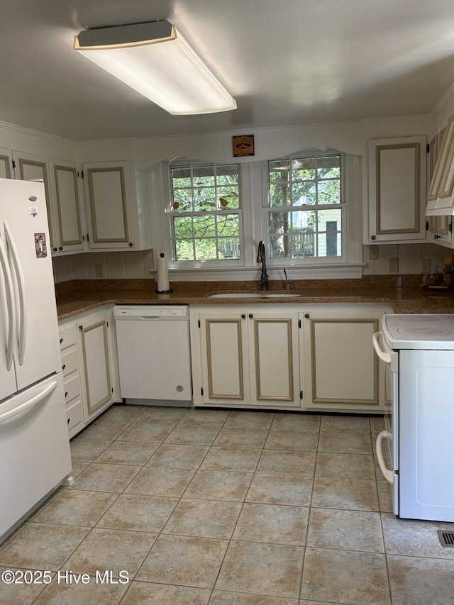 215 W Queen St, Edenton, NC 27932 - kitchen featuring white appliances, a sink, cream cabinetry, and light tile patterned floors