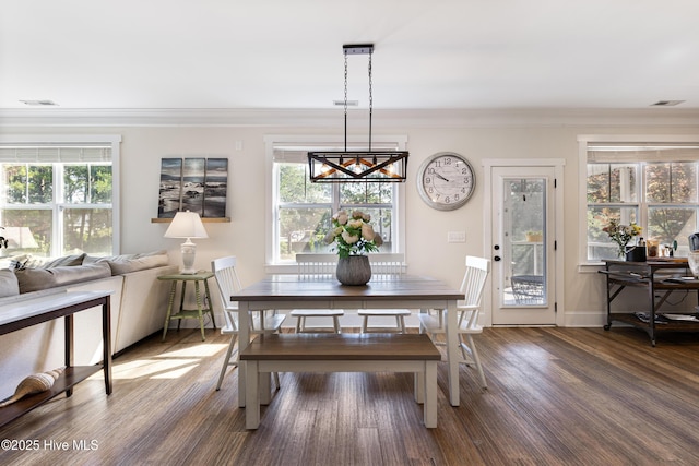 157 Heritage Way, Hampstead, NC 28443 - dining area featuring wood finished floors, ornamental molding, and healthy amount of natural light