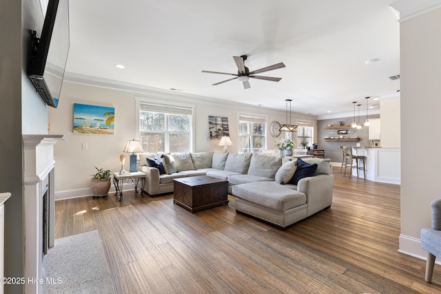 157 Heritage Way, Hampstead, NC 28443 - living room with ceiling fan, crown molding, dark wood-style flooring, baseboards, and recessed lighting
