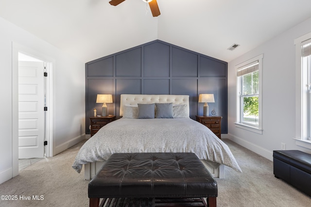 157 Heritage Way, Hampstead, NC 28443 - bedroom featuring light carpet, vaulted ceiling, a ceiling fan, baseboards, and a decorative wall