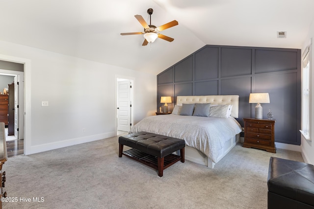 157 Heritage Way, Hampstead, NC 28443 - bedroom featuring vaulted ceiling, a decorative wall, light colored carpet, ceiling fan, and baseboards