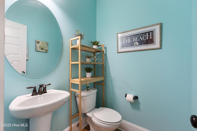 157 Heritage Way, Hampstead, NC 28443 - bathroom with toilet, baseboards, and a sink