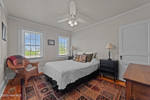 410 Craven St, Bath, NC 27808 - bedroom featuring wood finished floors, crown molding, baseboards, and ceiling fan