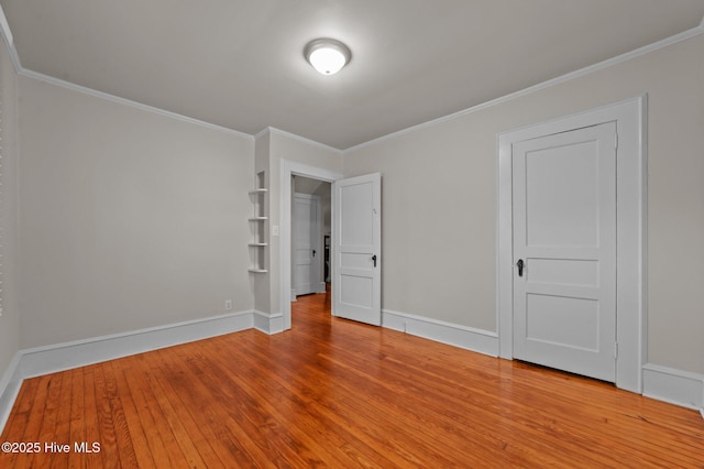 410 Craven St, Bath, NC 27808 - empty room featuring wood finished floors, crown molding, and baseboards